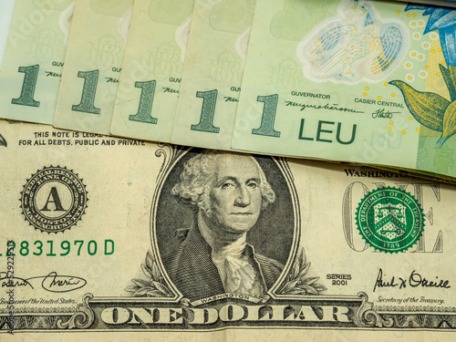 bankotes of romanian leu ron and dollar exchange concept