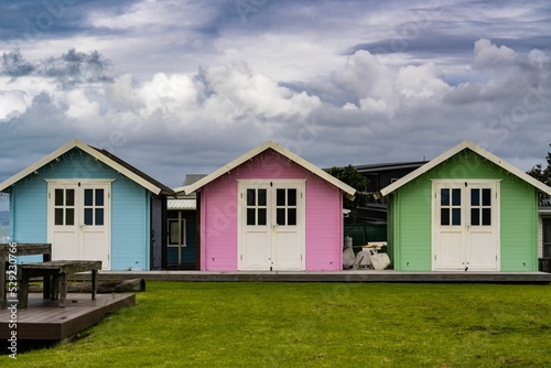 Colorful beach huts in Pukehina, North Island, New Zealand photo