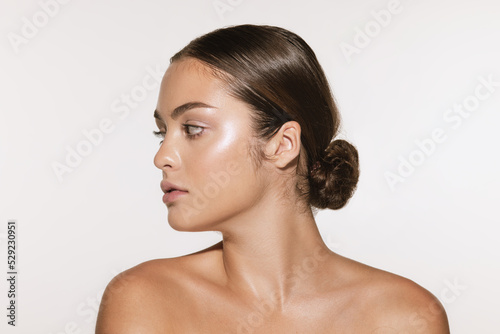 Portrait of young, beautiful and healthy girl with well-kept skin isolated on white background. The spa, surgery, face lifting and skin care concept