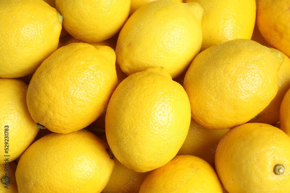 Many fresh ripe lemons as background, top view Many fresh ripe lemons as background, top view