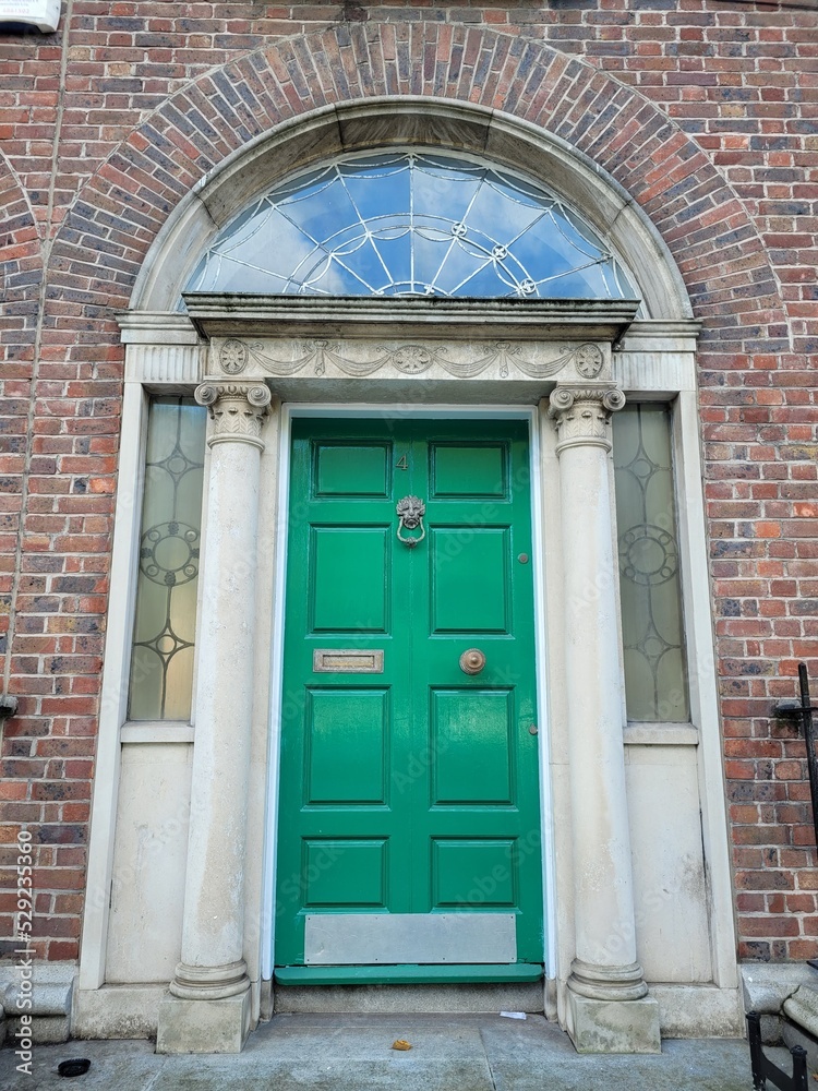 Green georgian door in Dublin, example of typical architecture of Dublin, Ireland Green georgian door in Dublin, example of typical architecture of Dublin, Ireland