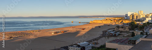 Sunset over the sea. Praia da Rocha, Portimão, Algarve photo