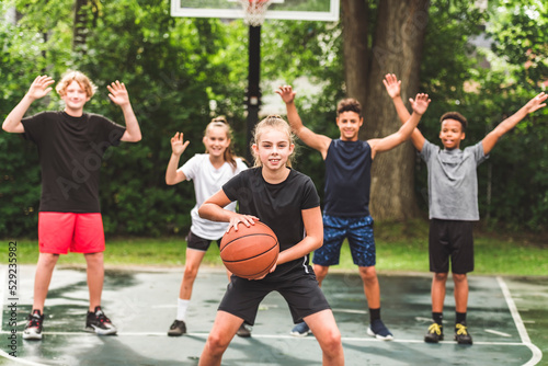 great child Team in sportswear playing basketball game