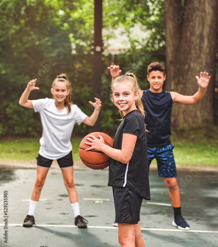 great child Team in sportswear playing basketball game