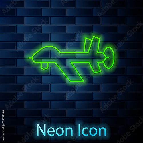 Glowing neon line UAV Drone icon isolated on brick wall background. Military Unmanned aircraft spy. Vector