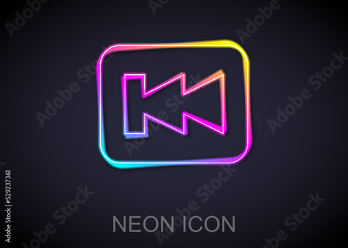 Glowing neon line Rewind button icon isolated on black background. Vector