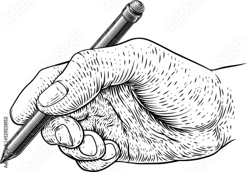 A hand holding a pencil in ...