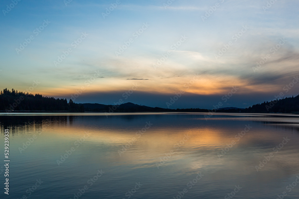 Beautiful misty sunset over the lake. Dexter reservoir, Oregon, USA Beautiful misty sunset over the lake. Dexter reservoir, Oregon, USA
