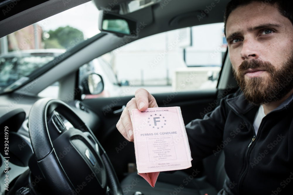 man gives his driver's license following a traffic violation man gives his driver's license following a traffic violation