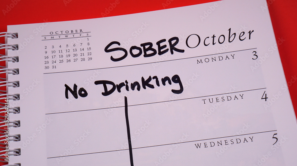 Sober October marked on a 2022 calendar. Sober October is the new and more poetic Dry January. It involves cutting out alcohol for 31 days, often for charity. - obrazy, fototapety, plakaty 