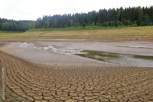 August 25 2018 - Lehnmuehle, Saxony, Germany: A dried up empty reservoir and dam during a summer heatwave, low rainfall and drought in Saxony, Germany, Talsperre Lehnmuehle