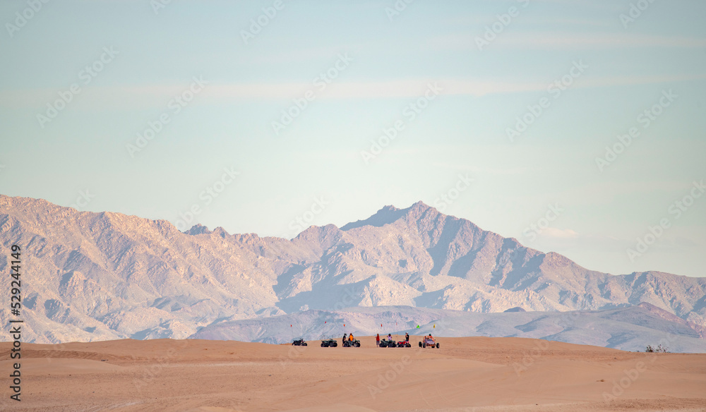 Group of off roaders on desert sand dune