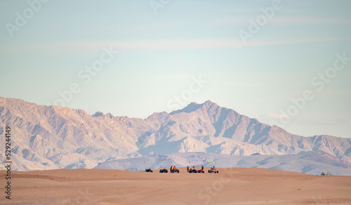 Group of off roaders on desert sand dune