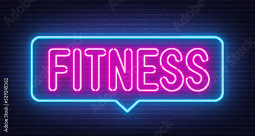 Fitness neon sign in the speech bubble on brick wall background.