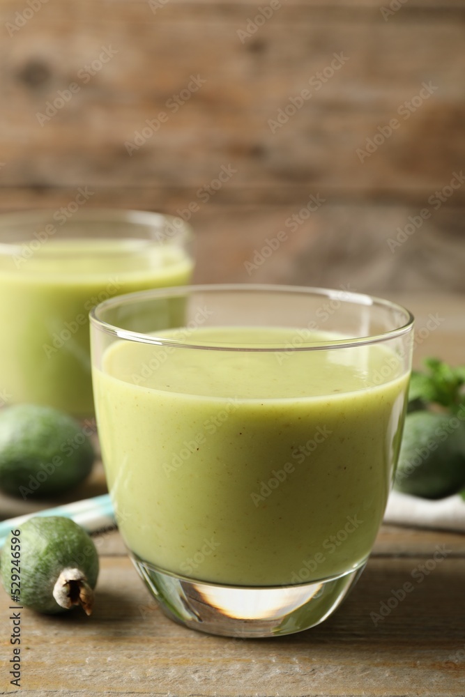 Fresh feijoa smoothie on wooden table, space for text Fresh feijoa smoothie on wooden table, space for text
