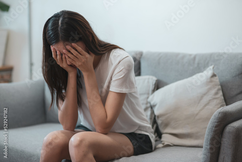 Close up young Asian woman feeling upset, sad, unhappy or disappoint crying lonely in her room. Young people mental health care problem lifestyle concept.