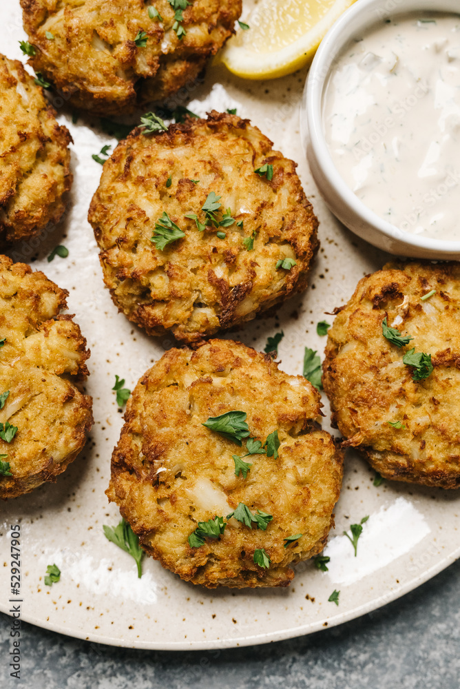 Homemade crab cakes with tartar sauce Homemade crab cakes with tartar sauce