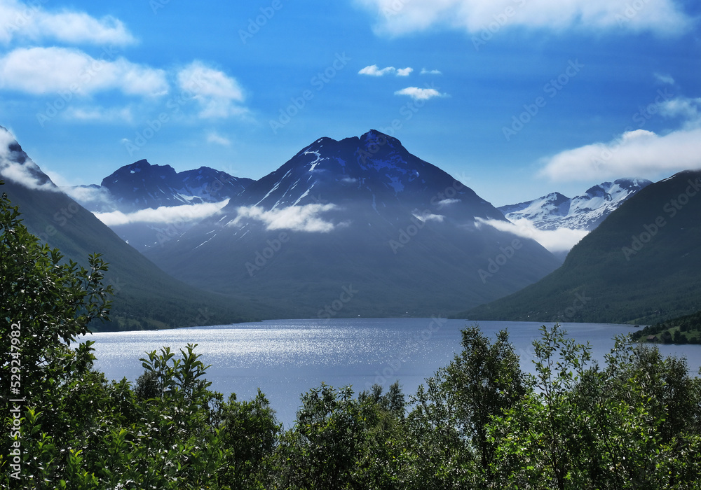 Scandinavian landscape: Mountains towering over a fjord in Breivikeidet, Norway
