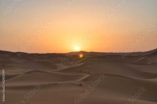 Fototapeta Naklejka Na Ścianę i Meble -  Dunes in the Sahara desert at sunrise, the desert near the town of Merzouga, a beautiful African landscape