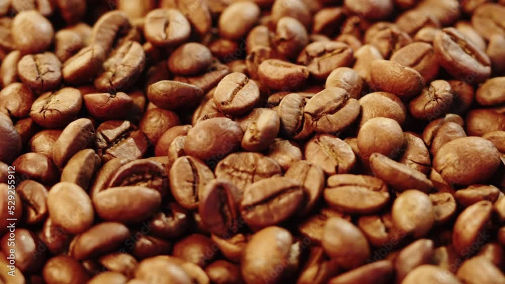 Roasting coffee beans with smoke on dark background, close up arabica robusta colombian beans. Roasting coffee beans with smoke on dark background, close up arabica robusta colombian beans.