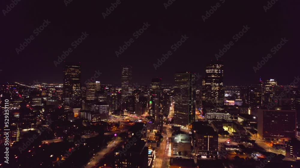 Aerial view of downtown Denver at night. Buildings of Denver from top view. Business center of Denver on evening time. Aerial view of downtown Denver at night. Buildings of Denver from top view. Business center of Denver on evening time.