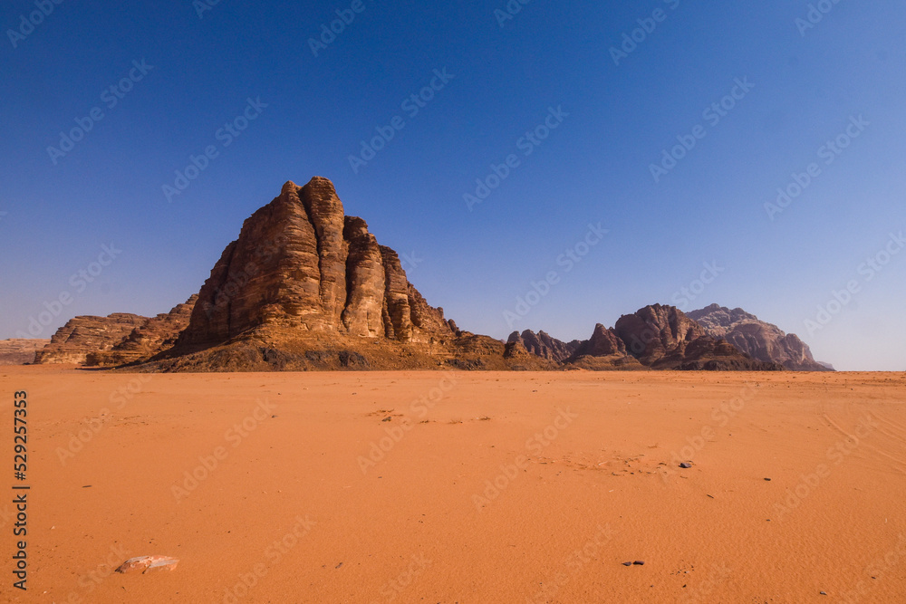 Wadi Rum Desert landscape in Jordan. Dunes and mountains. Travel and tourism concept. Wadi Rum Desert landscape in Jordan. Dunes and mountains. Travel and tourism concept.
