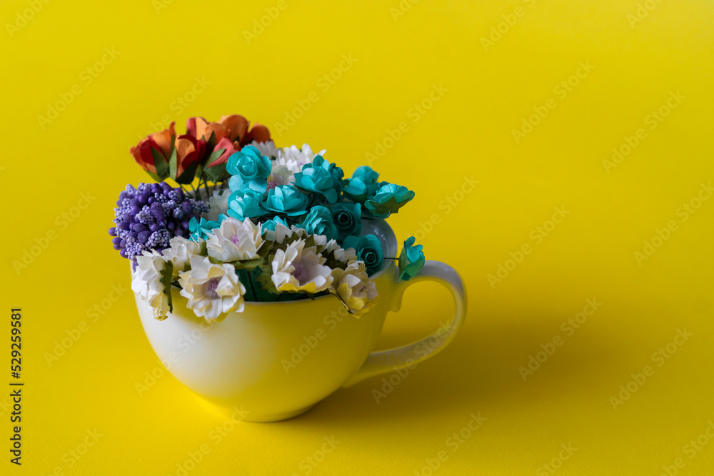 creative concept, white cup with hot drink with big flower bouquet inside