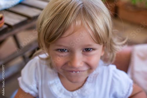 Portrait of a 2 year old little boy. View from above of a beautiful blond boy with a nice smile.
