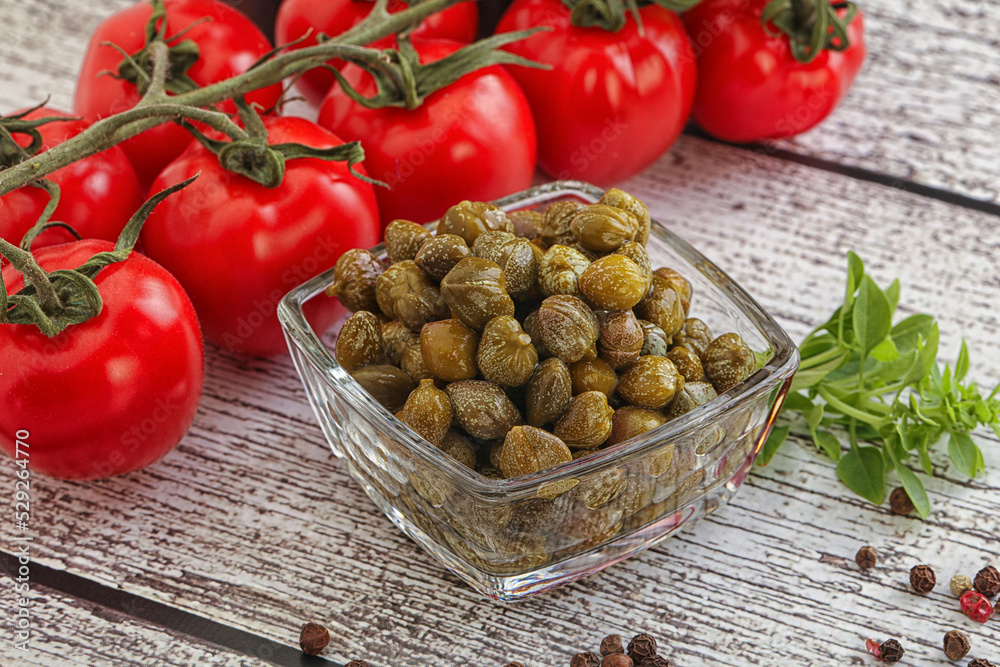 Marinated green capers in the bowl