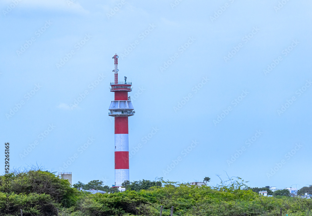 A Lighthouse near a sea beach