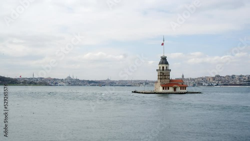 Dolly shot of Maiden's Tower and the Bosporus. Famous tourist attraction amidst coastal region against sky. Tourist destination in Istanbul, Turkey. High quality 4k footage photo