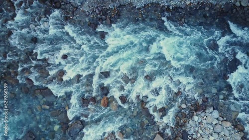 Rocky river flowing though rough terrain in Spain photo