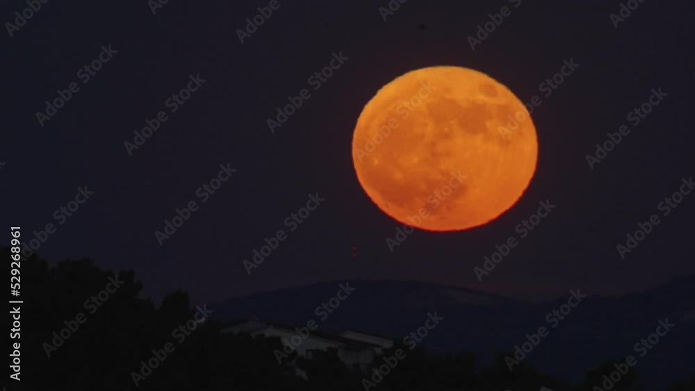 Big yellow moon in the mountains. Beautiful state of nature at night. High quality 4k footage Big yellow moon in the mountains. Beautiful state of nature at night. High quality 4k footage
