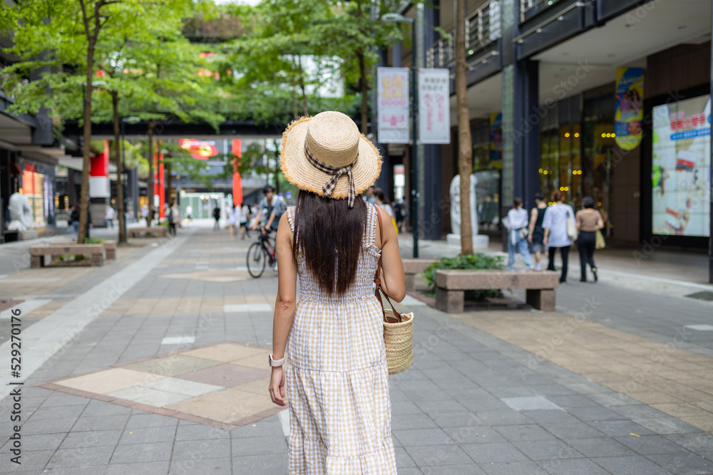 Tourist woman walk in  Xinyi district in Taipei city of Taiwan