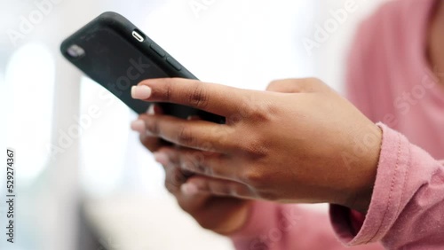Woman hand with phone on social media and internet app online in home. Texting message or communication to contact with mobile smartphone in the living room while reading email and browsing the web photo