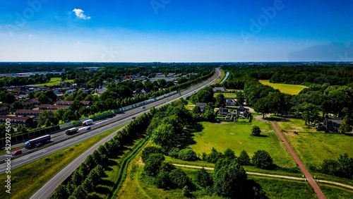 Aerial shot of A32 near Heerenveen with a blue skyline and vegetation
