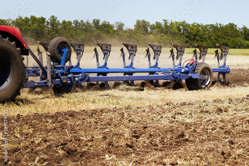 Large modern plow for cultivating the land. © SKfoto