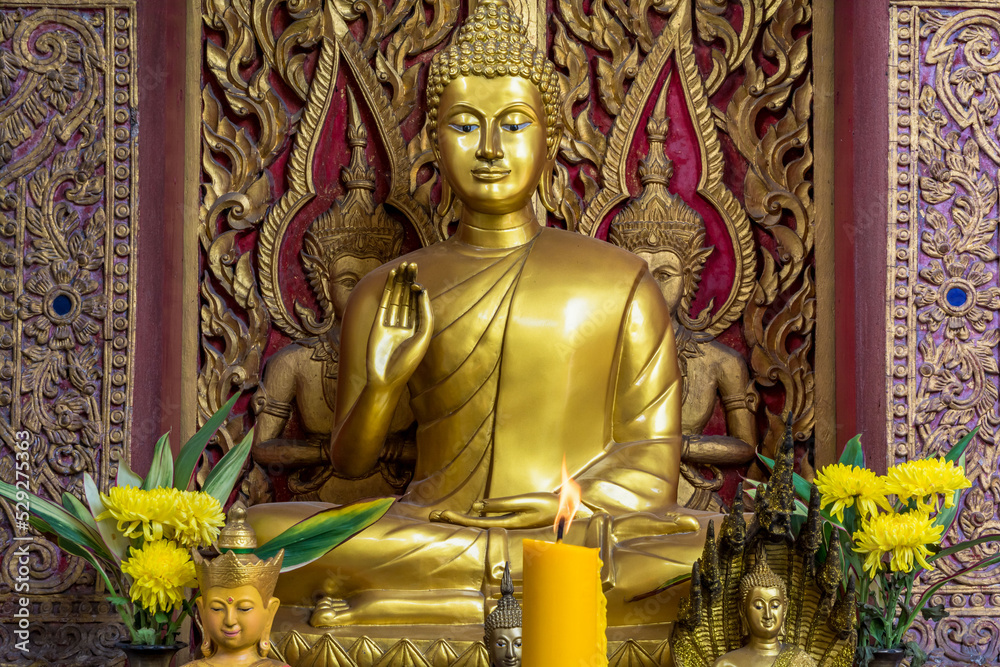 Golden Buddhas  statue in a temple in Thailand