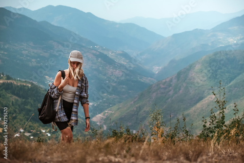 Travel. Girl travels through the mountains glamping, tents,waterfalls of wild nature. Unity, mental health, eco travel. Hiking in the mountains, van life vibes, travelling,good moments, digital detox