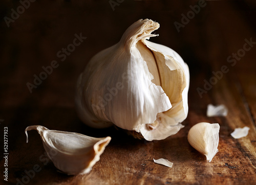 Close-up of garlic on wooden table photo