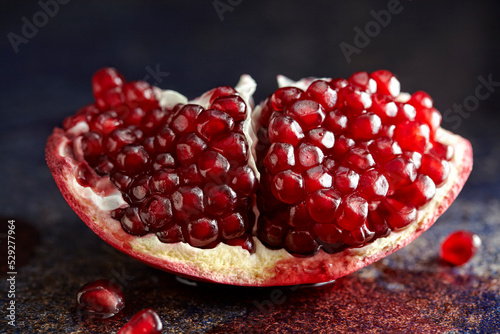 Close-up of pomegranate slice on table