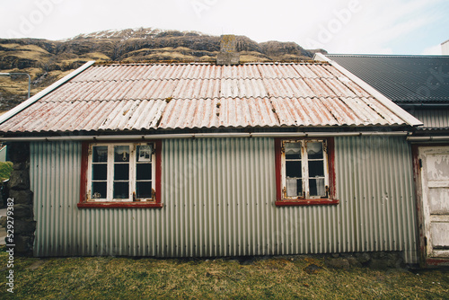 Corrugated iron house on field photo