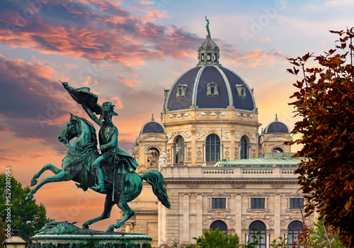 Statue of Archduke Charles and Museum of Natural History dome at sunset, Vienna, Austria