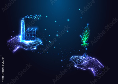 Carbon offset, carbon neutral concept with hands holding factory plant and green sprout on dark blue
