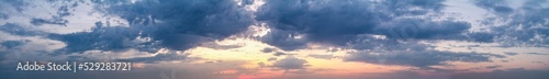Beautiful summer sunset with a cloudy sky, panorama, banner © rustamank