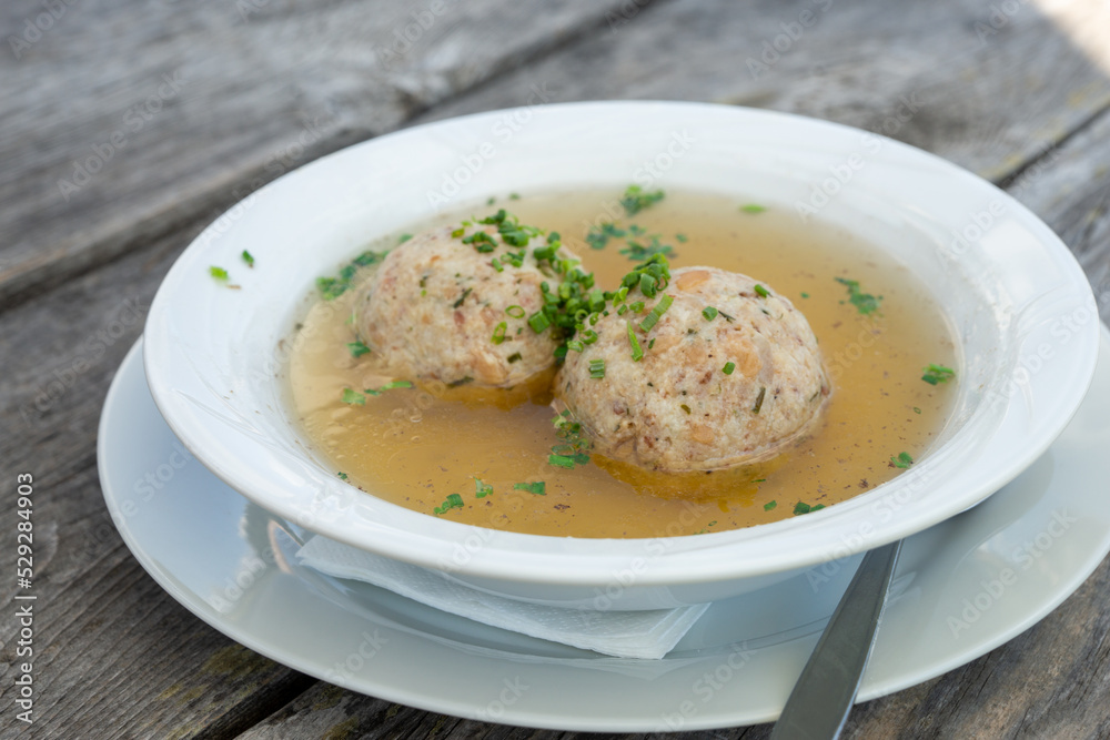 tyrolean bacon dumpling soup, ready to eat, close up tyrolean bacon dumpling soup, ready to eat, close up