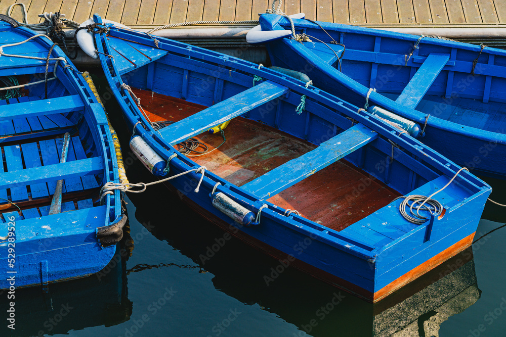 Blue boats moored in the port of the city of Luarca, in Asturias.