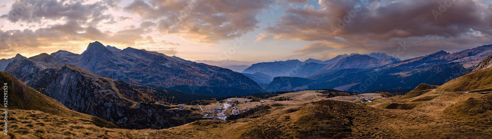 Evening dusk autumn Dolomites panoramic Rolle Pass view, Trento, Italy.