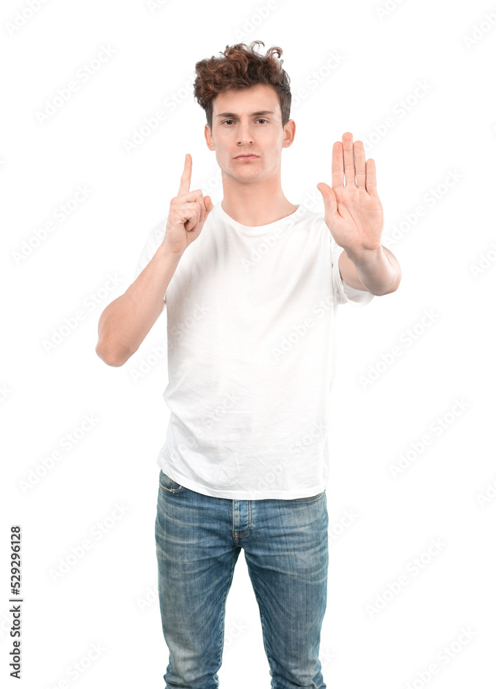 Serious young guy with a gesture of stop Serious young guy with a gesture of stop