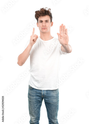 Serious young guy with a gesture of stop